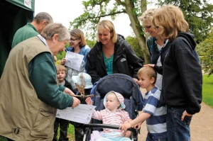 Volunteer educating a family about Westonbirt Arboretum